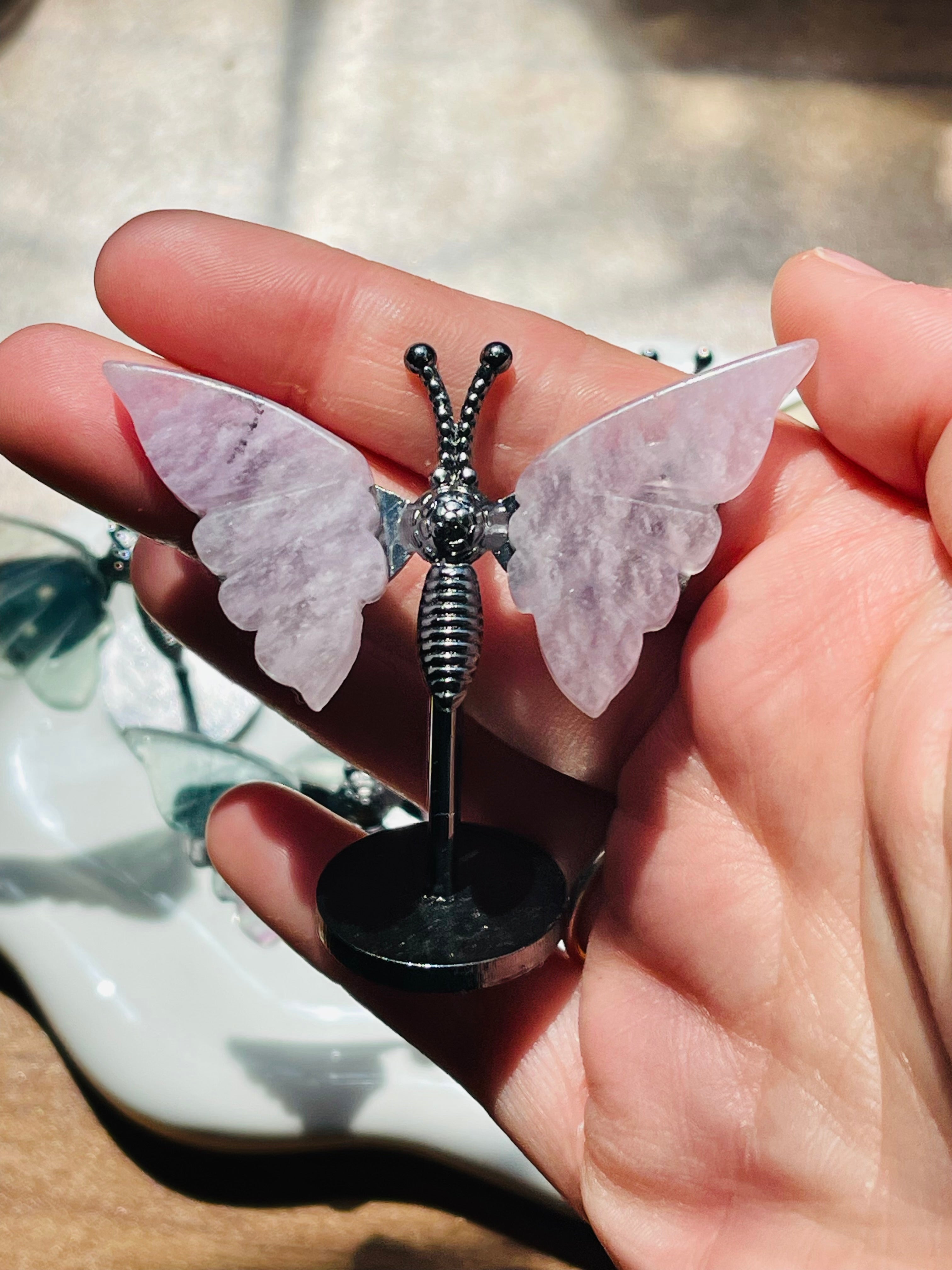 Mini fluorite butterfly wings on a stand