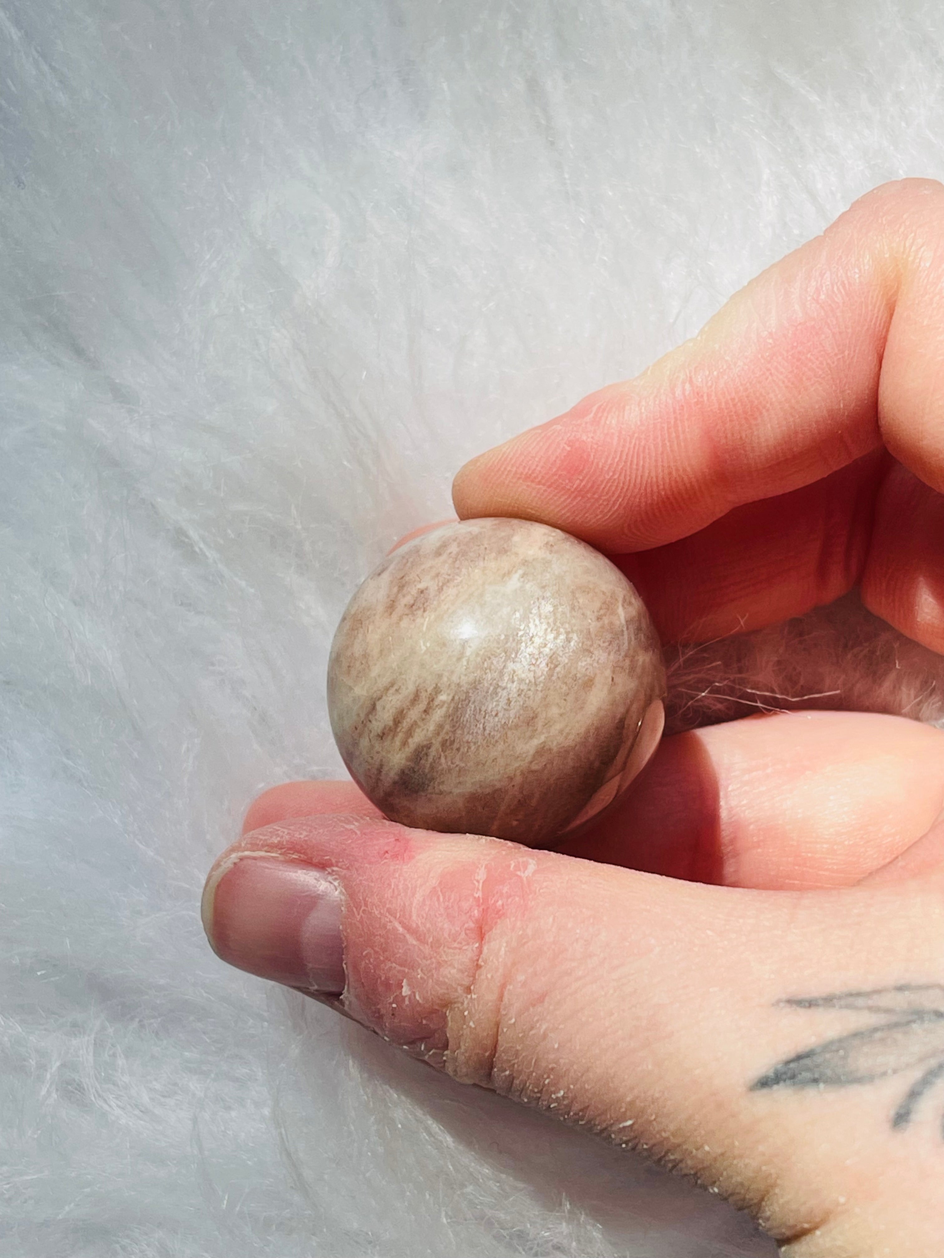 Peach Moonstone W/Sunstone Sphere